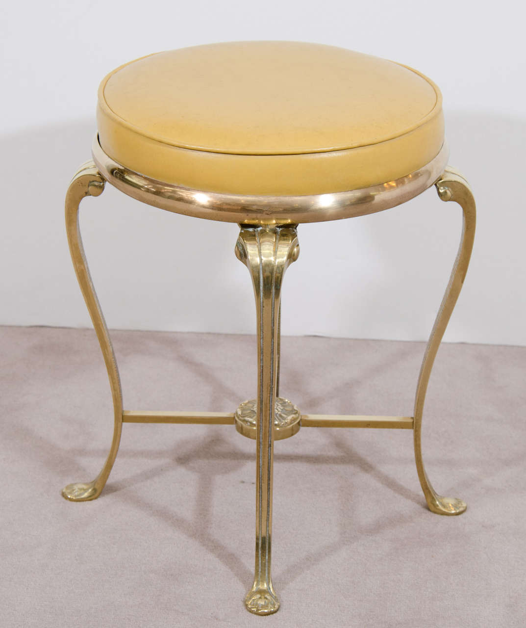 A vintage solid brass vanity stool with original yellow vinyl upholstery, circa 1950s. 

Good vintage condition with age appropriate patina.

Reduced from: $1,050