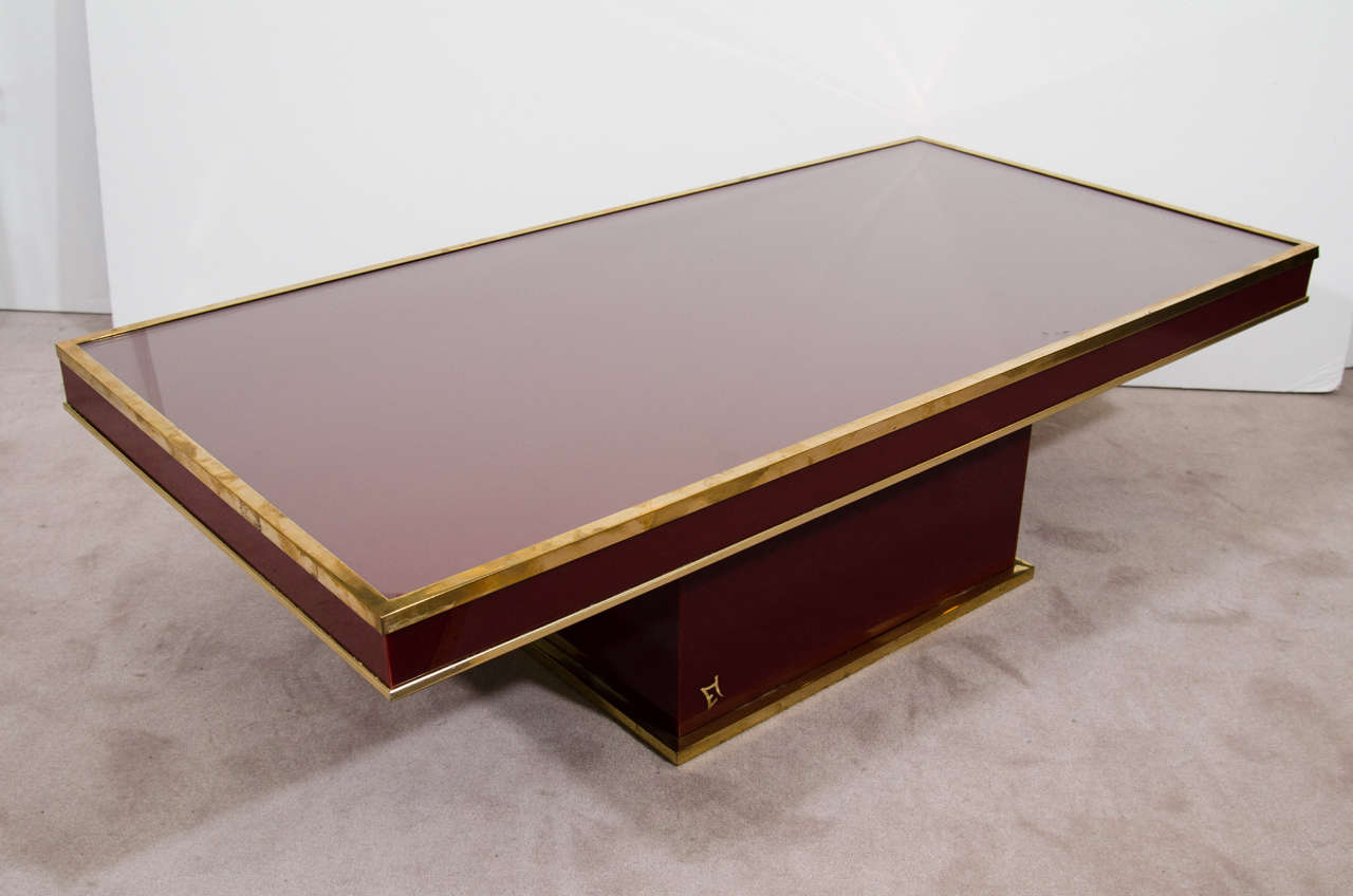 A vintage French Bordeaux red lacquer and brass trim coffee or cocktail table by Eric Maville.

Good vintage condition with age appropriate wear and patina. Some scuffs and wear to brass.

Reduced from: $4,800.