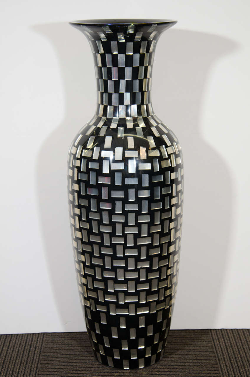 A contemporary decorative monumental scale vase in black with iridescent mosaic glass tile.
