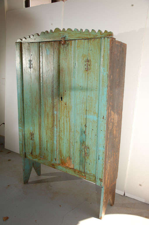 Antique polychrome painted two door cabinet from Guatemala. Original fittings, interior repainted at some point in time.  Three interior shelves.