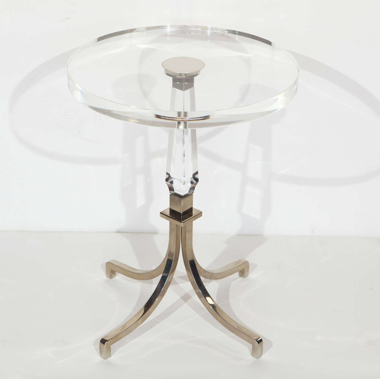 An amazing Charles Hollis Jones Regency table in nickel and Lucite. This is one of his most popular tables with beautiful lines. Will be signed by designer after purchase.