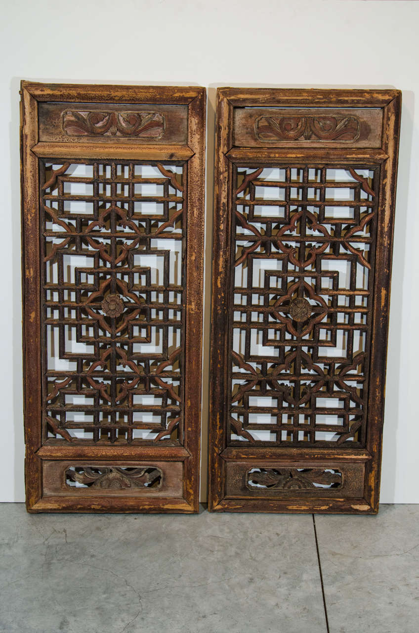 A pair of nicely carved 19th Century window screens with fine patina.  From Shanxi Province, c. 1850.
P351