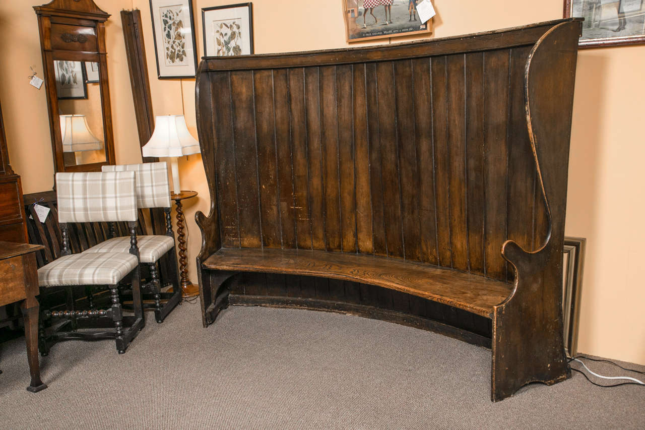 A very rare English, elmwood settle bench in great patina and form.
Size; overall width 85, seat width 77.50 inches.
 Overall depth 28 inches, seat depth 15 inches.
 Overall height 62 inches death height 15 inches.