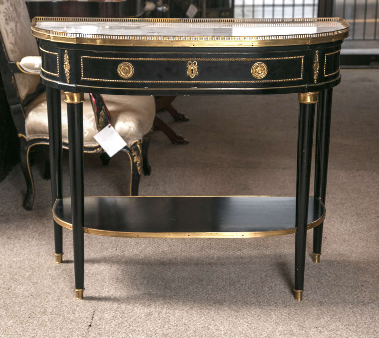 Maison Jansen demilune console table. This fabulous Louis XVI inspired demilune console is one of the older pieces by this renowned designer we have had to offer in quite some time. The all-over bronze mounts of fine casting and gilt quality.