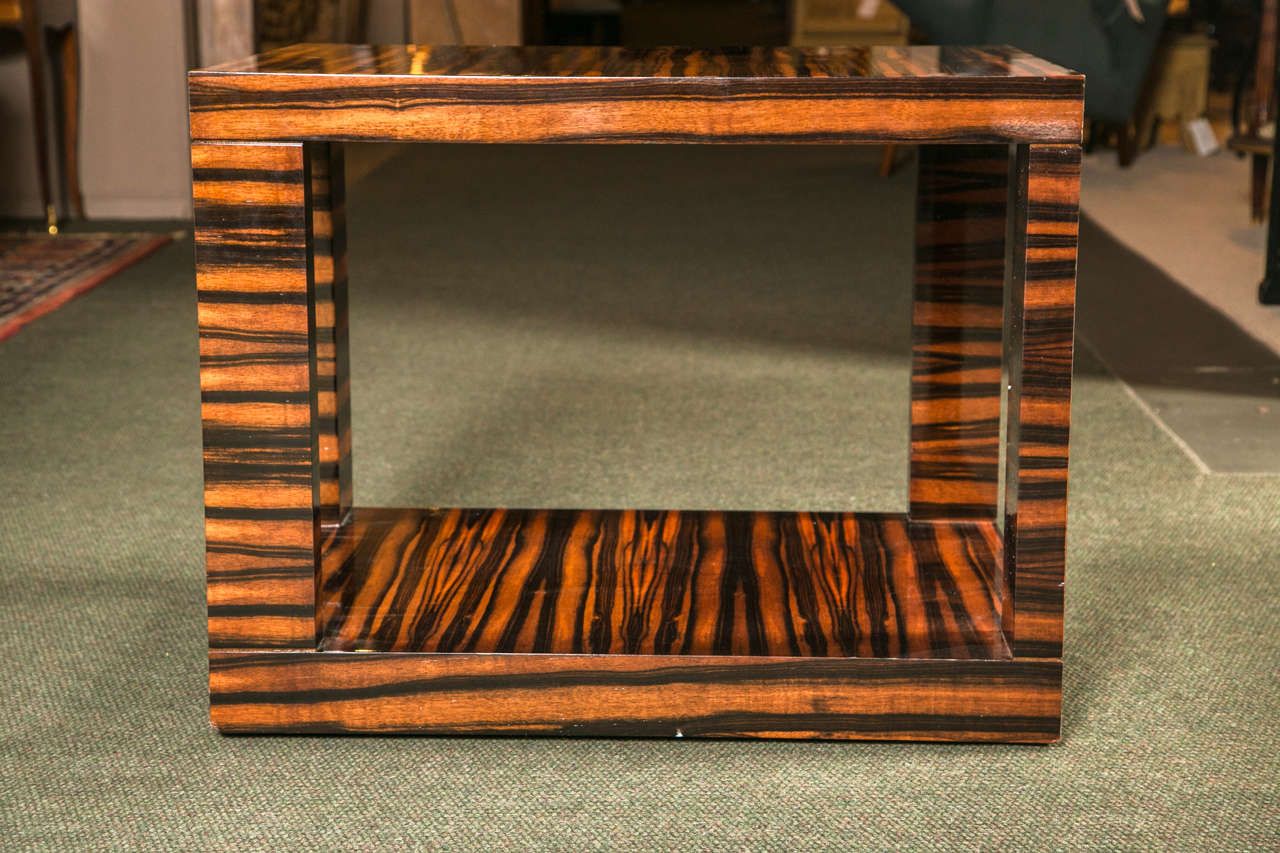 A pair of calamander wood occasional tables in Art Deco style.