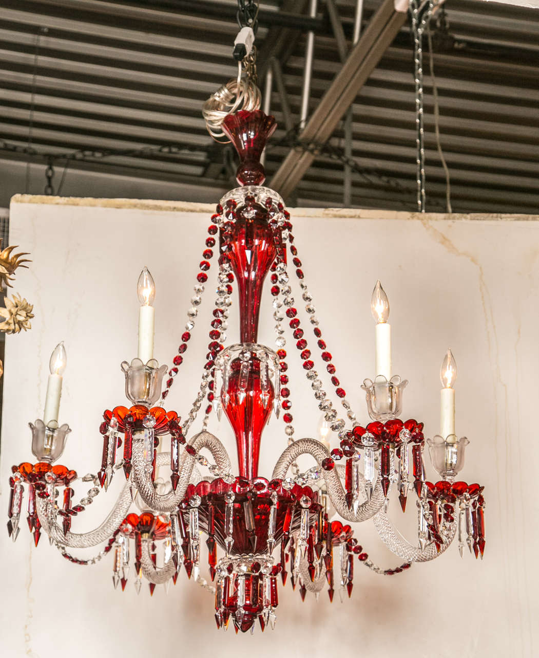 An antique English ruby red and clear crystal, six-light chandelier. It has been electrified.