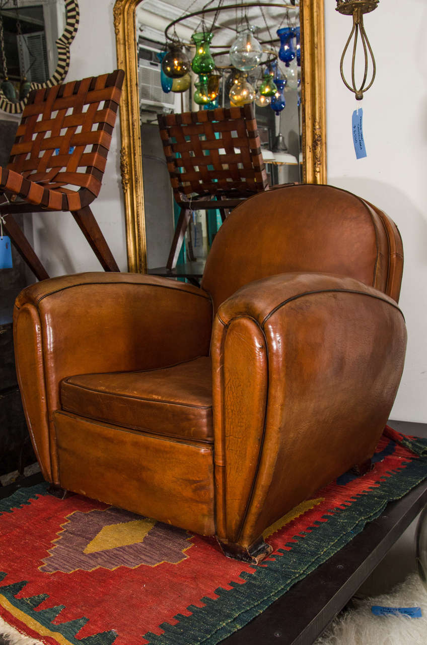 French pair of round back leather club chairs with ottoman. 
Original leather, 1940s.