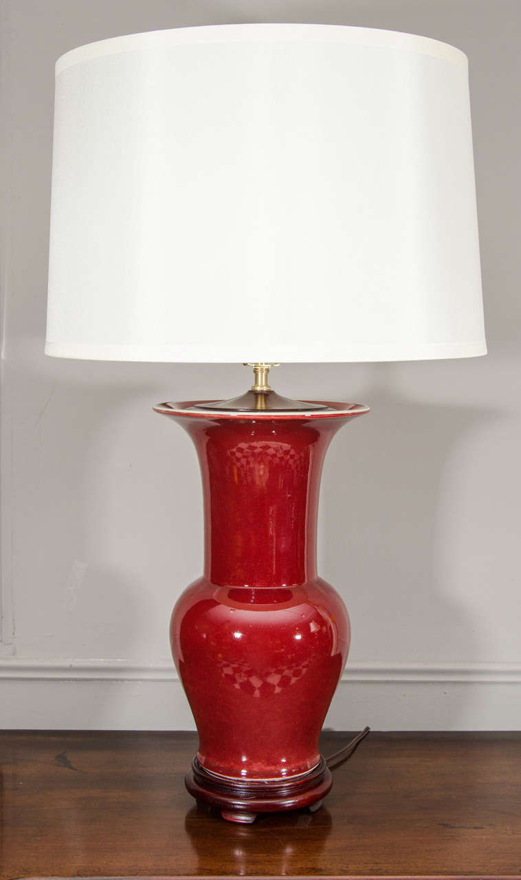 Single Chinese Langyao Hong Oxblood Red Porcelain Fishtail Vase, Wired as a Lamp. On a wooden base. Shade available separately.

