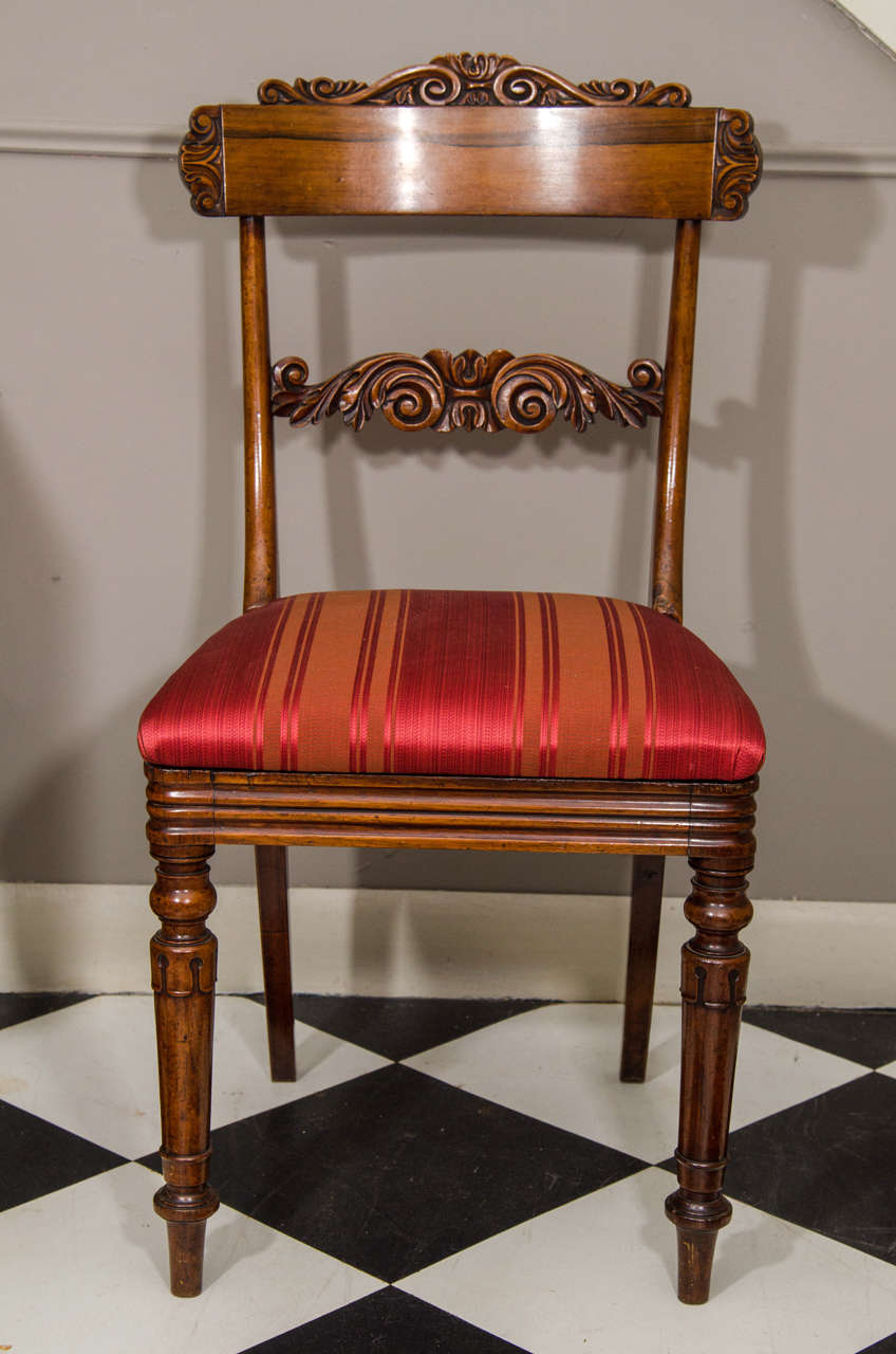 Set of eight William IV dining chairs with carved tablet, circa 1840.