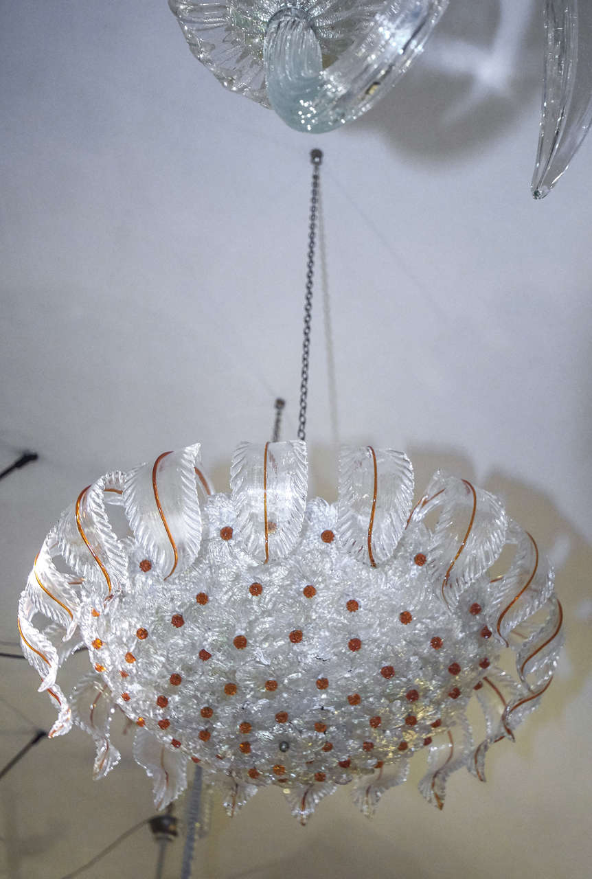 Seguso Murano plafoniere formed with many blown glass flawers and glass leaves with gold inside.
Five bulbs inside.