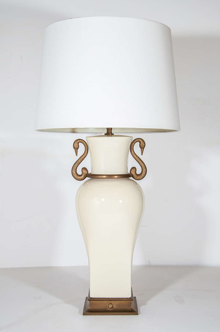 Stylized swan handles with bronze base and fittings