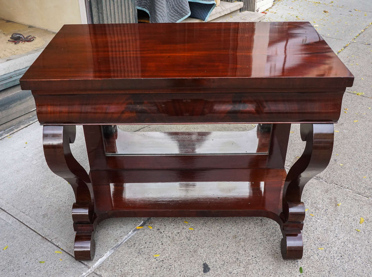 This robust and dramatic table designed for use between a pair of windows in grand Greek revival country homes in America was a standard design element in its time. Made of expensive and hard to get imported mahogany with pine secondary’s. The large