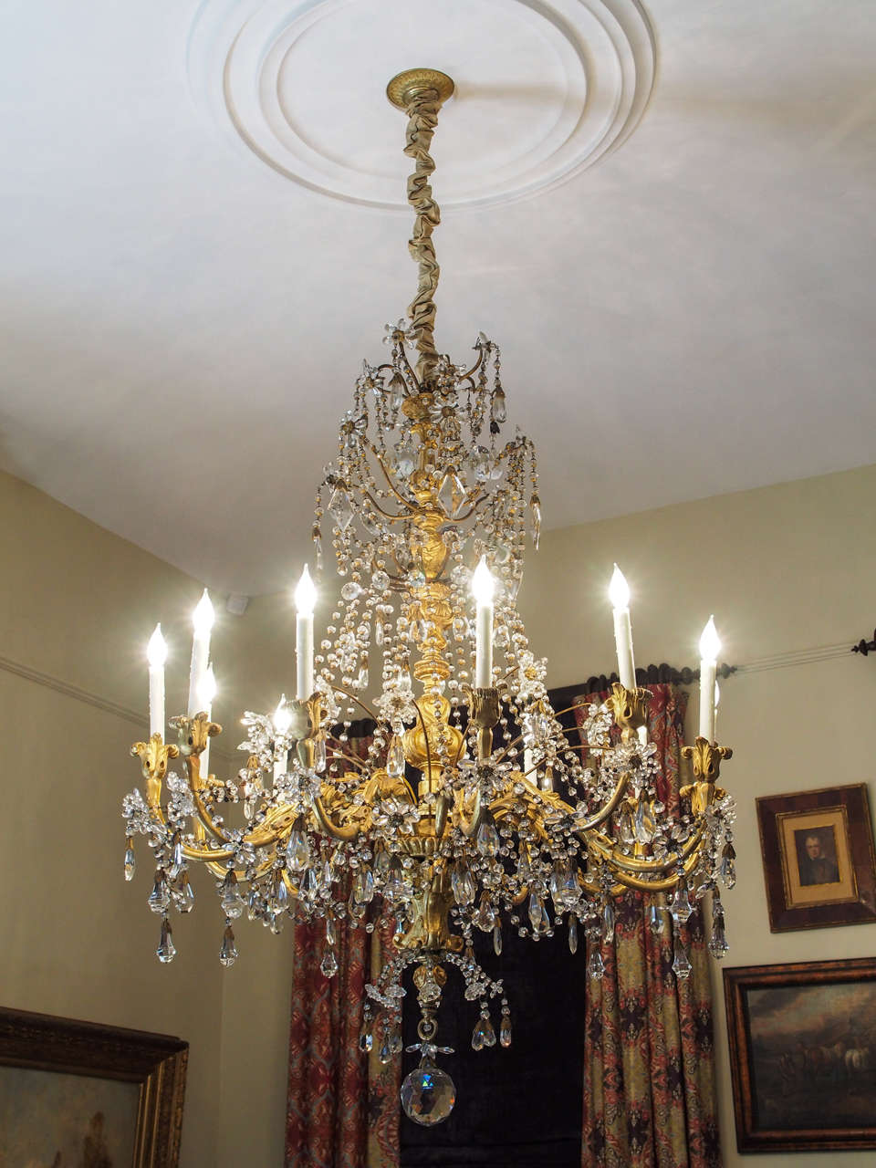 Italian Regence giltwood and crystal monumental scale chandelier. This chandelier is now wired for US current.