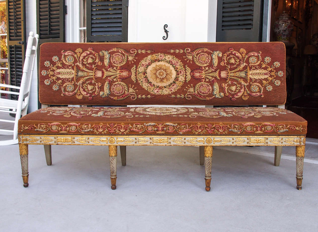 Exceptional French Empire Aubusson covered hall bench with painted and parcel-gilt frame.