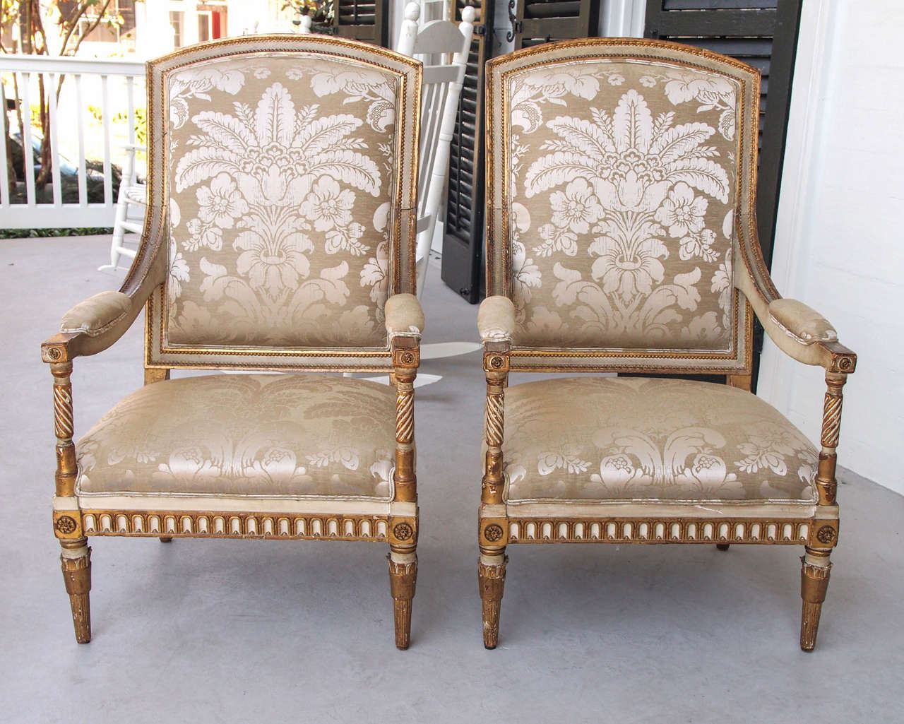 Italian Louis XVI style painted and parcel-gilt armchairs of unusual form.
Now covered in Cowtan Tout silk or linen.