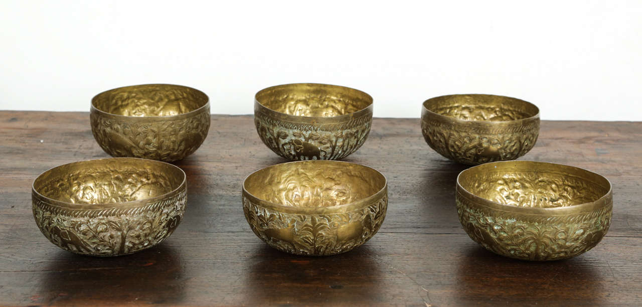 Set of six antique brass bowls.
Nicely handcrafted and hand-hammered with floral and elephant figures.
Very nice patina for this set of decorative magic bowl.