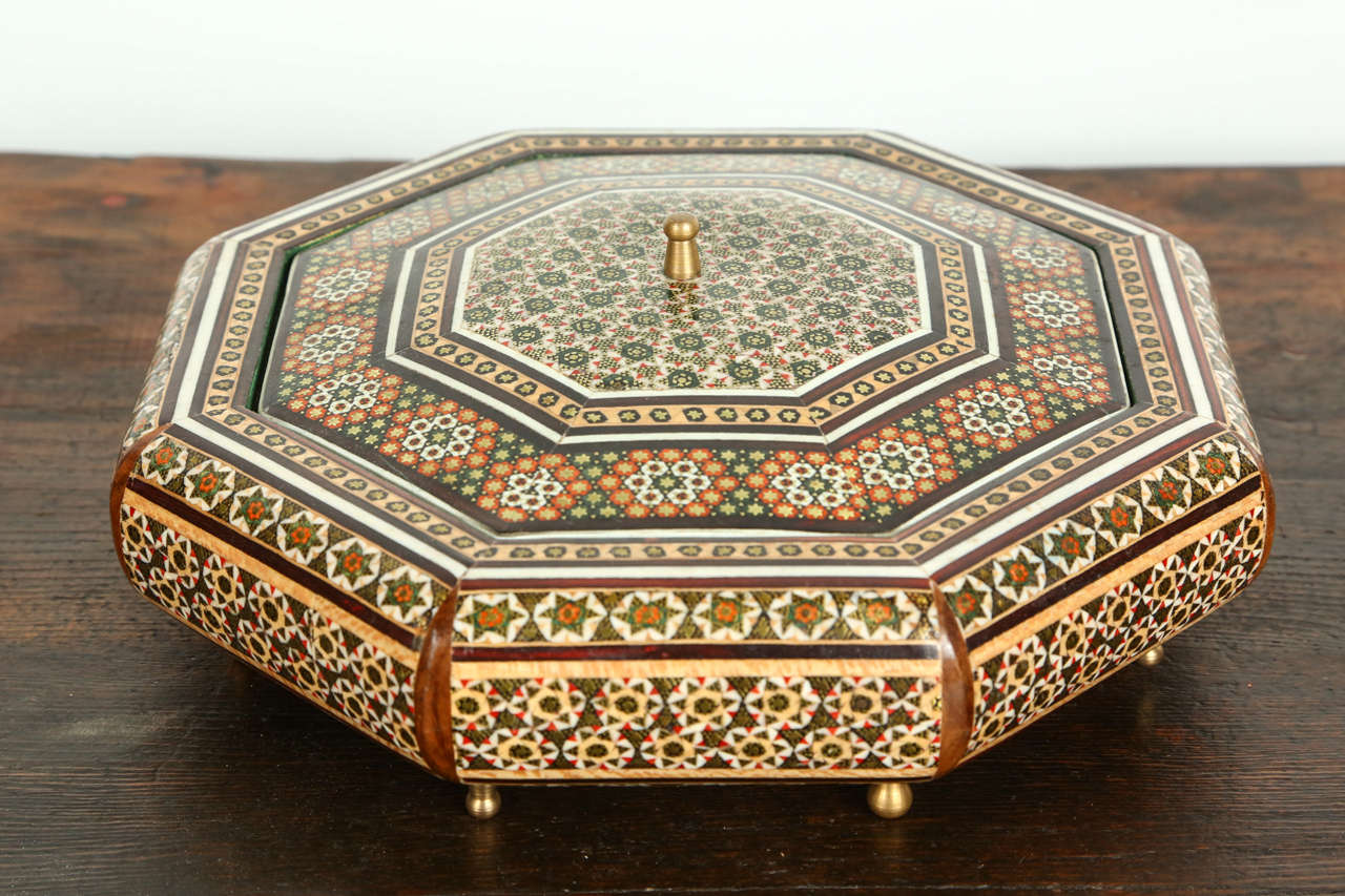 Anglo-Indian micro mosaic octagonal inlaid box with floral and geometric design, with small legs and a cover.