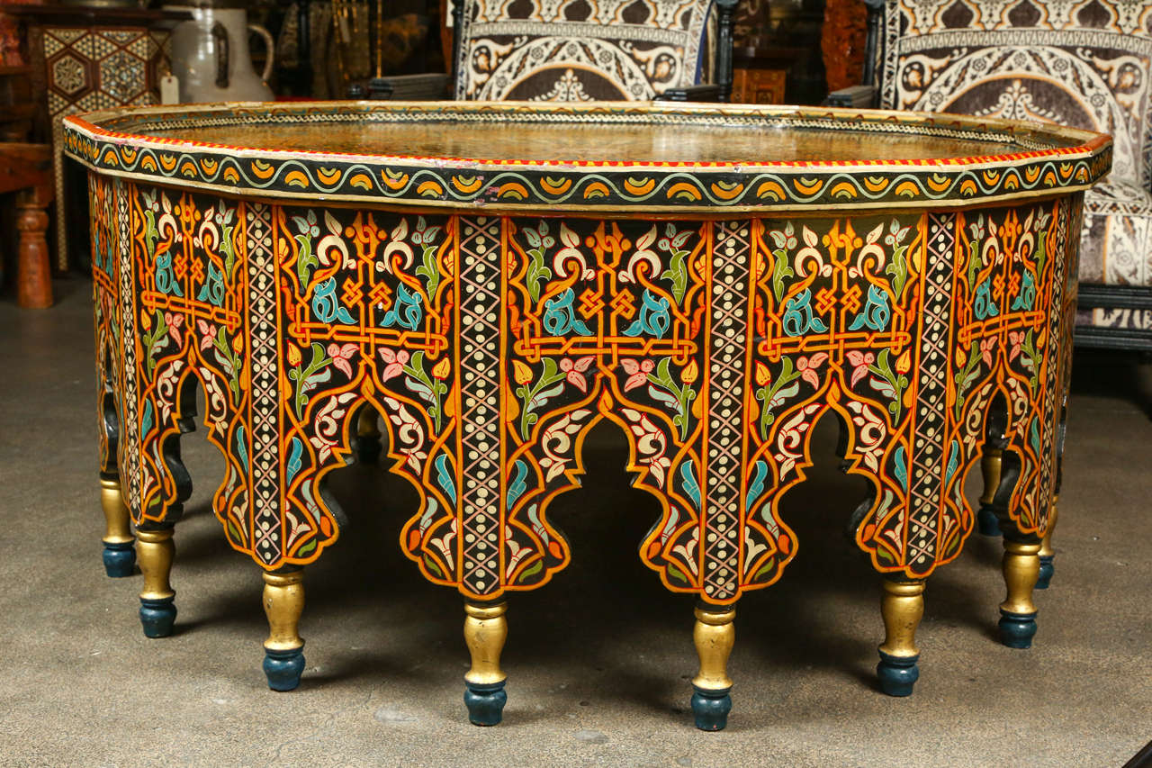 Handcrafted, hand-painted gorgeous Moroccan coffee table.
Polychrome with 18 sides with Moorish arches cut-out, intricate floral and geometric design.
Heavy custom-made table.
Please check pictures 7 and 8 for some scratches and a small missing