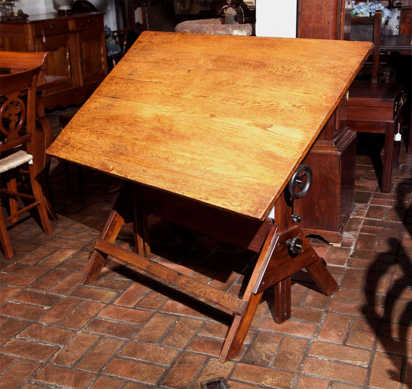 This beautiful drafting table, having served dutifully in the industry for years, is now being put out to pasture to begin life anew.  Surely it is in fine condition and could once again be drafted into service for actual drawing, but its height is