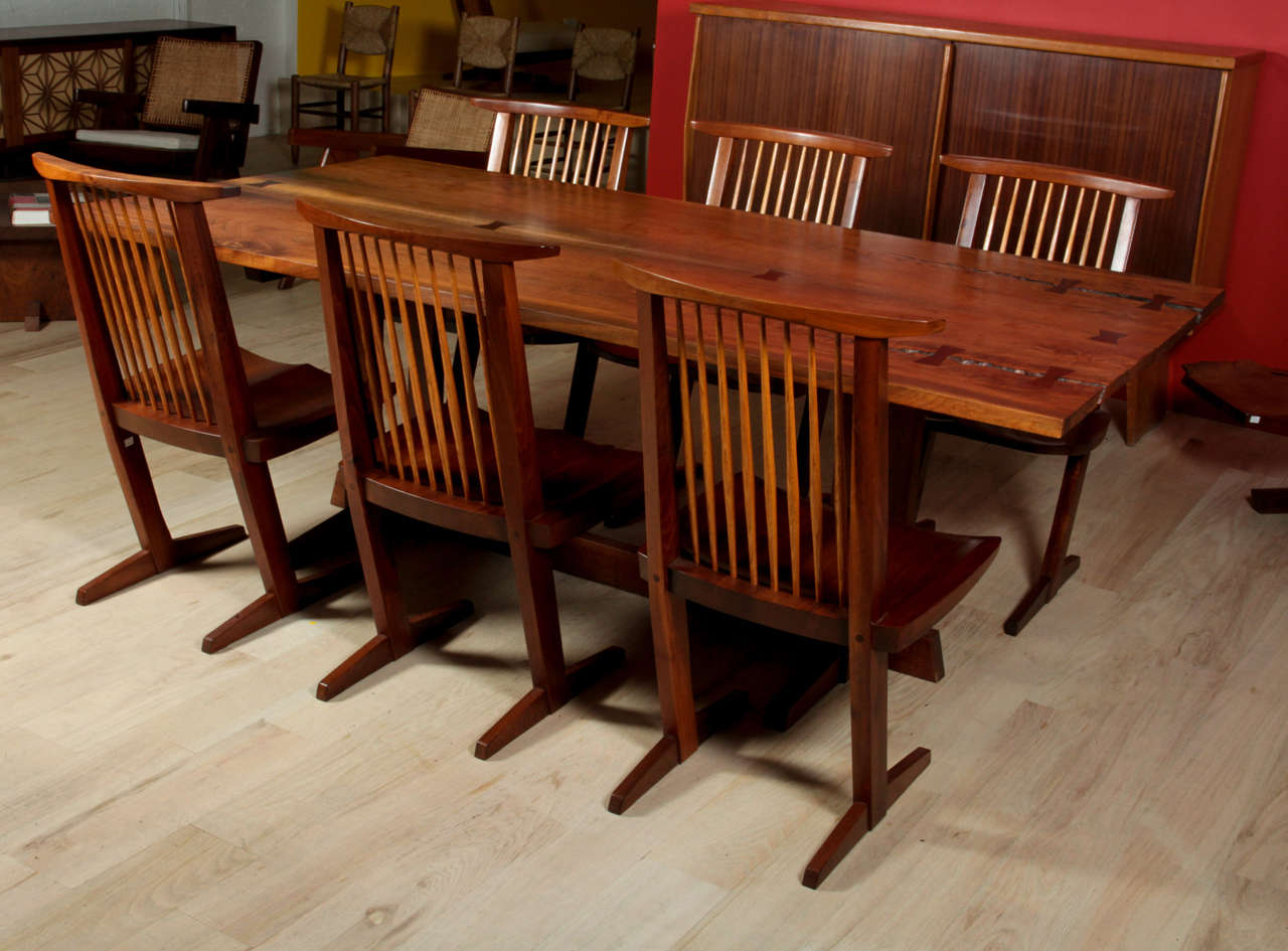 Dining table in walnut, bookmatched, eight butterfly joints on a Frenchman's Cove base.

Provenance available.