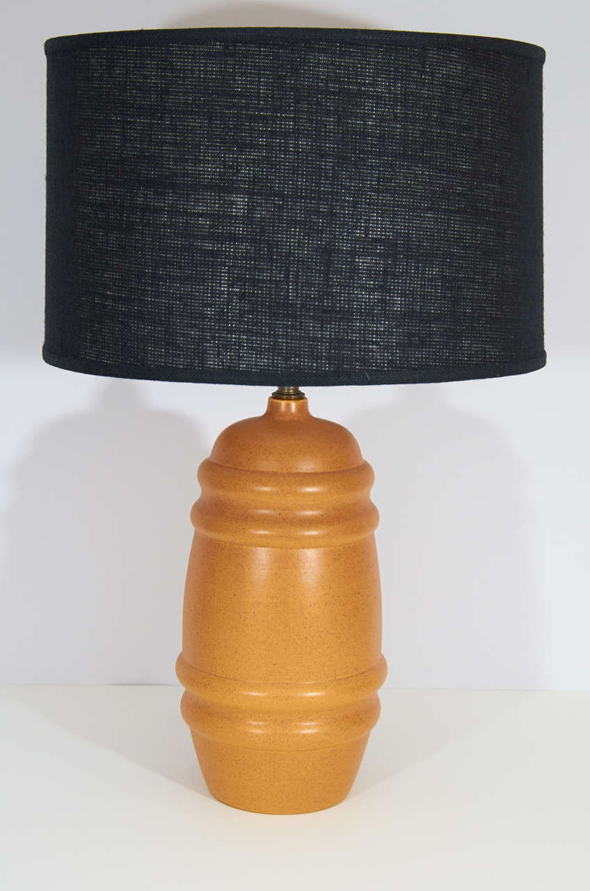 Large pair of Royal Haeger lamps in a matte mustard glaze. They have a charming profile. Please contact for location. 
