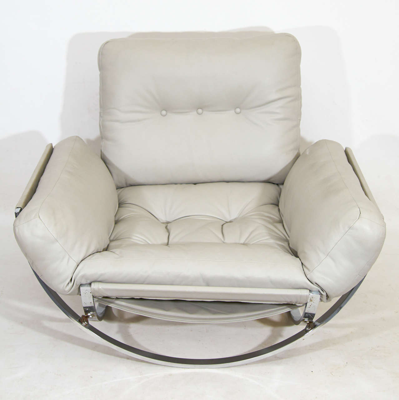 Large-scale lounge chair with big sculptural chrome hoops and a nice dove gray leather. By Leonnart Bender for Charlton Furniture company. Bold and very comfortable. Please contact for location. 