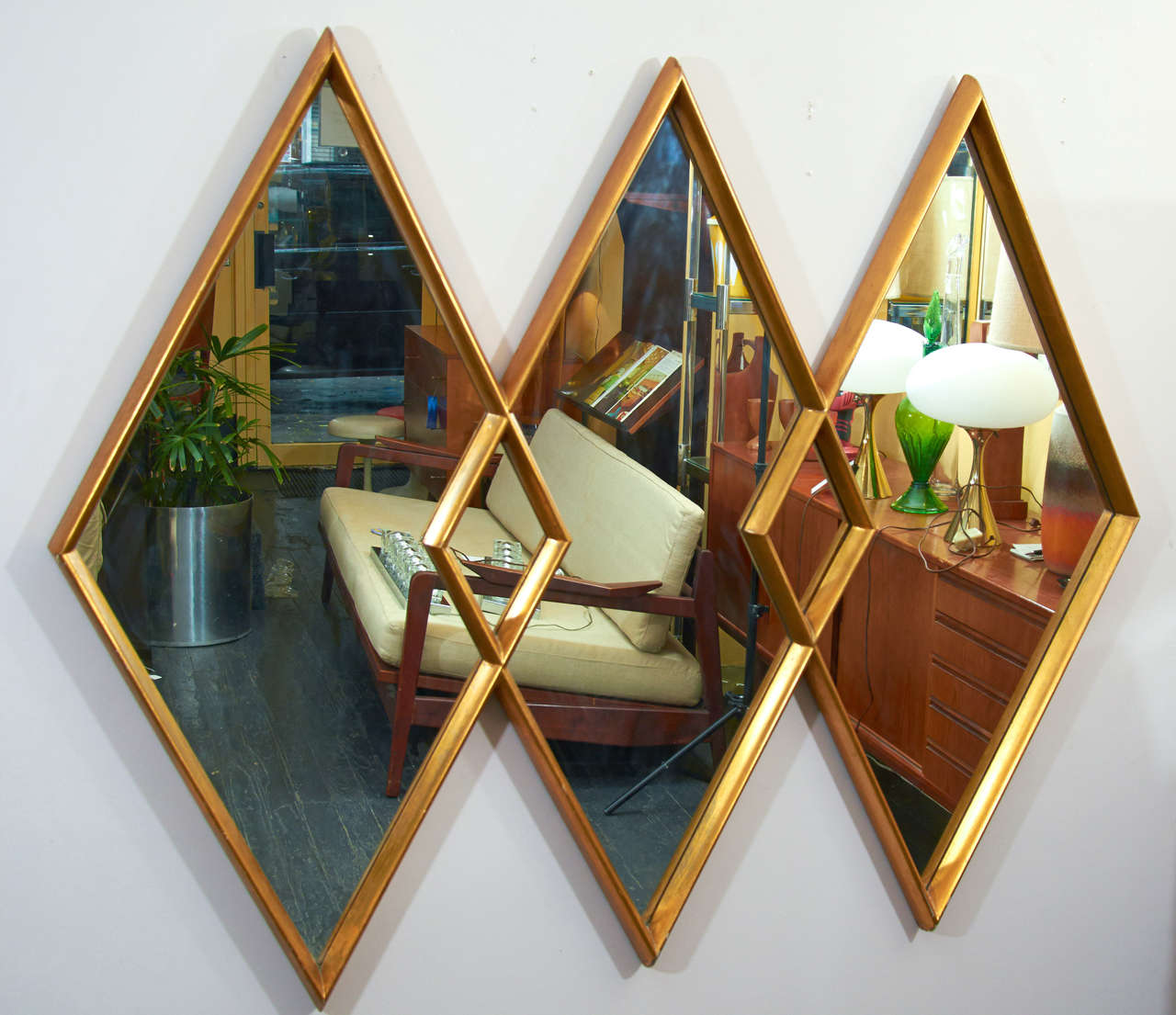 Grand and glamorous triple diamond mirror by La Barge. The wood frame is gold leaf.