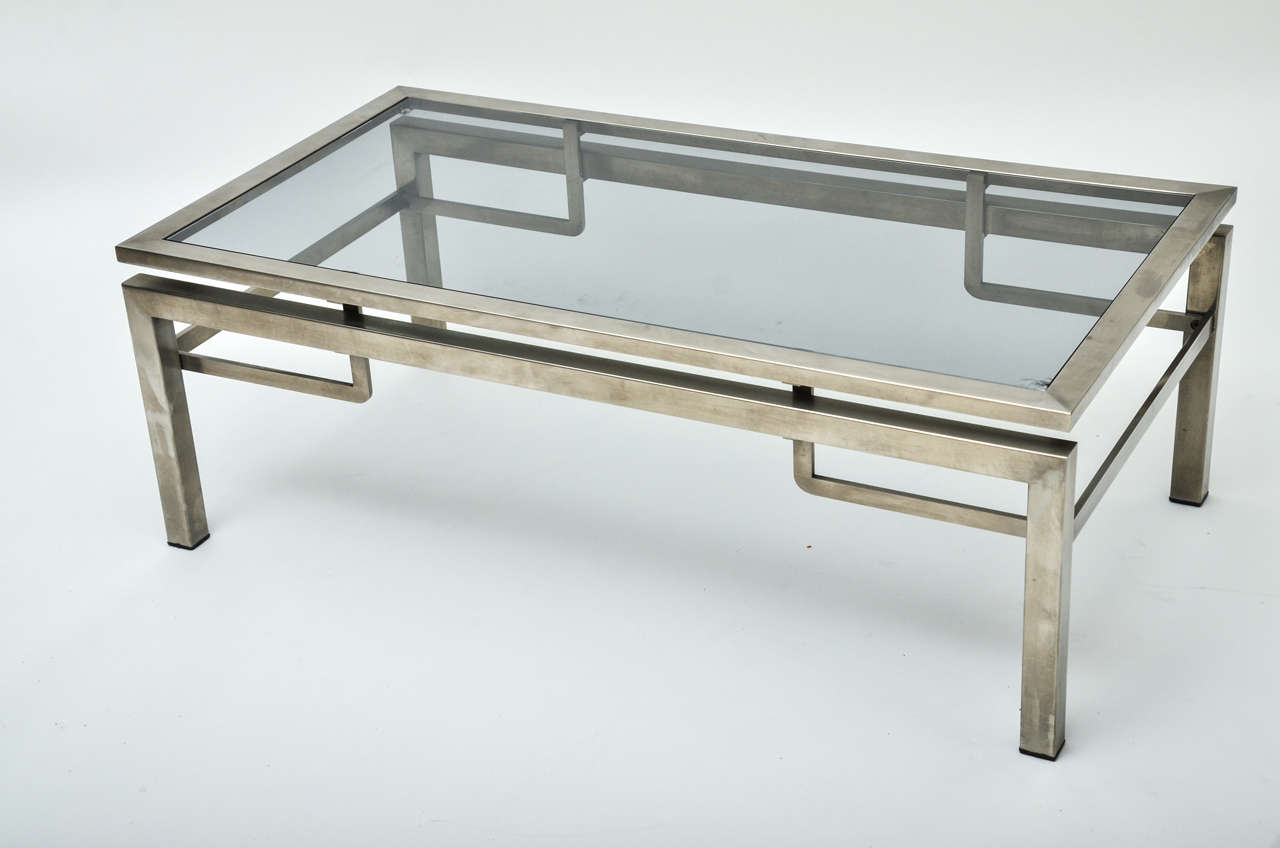 A 1960s, French Guy Lefevre chrome coffee table with brushed chrome. A matching pair of side tables available.