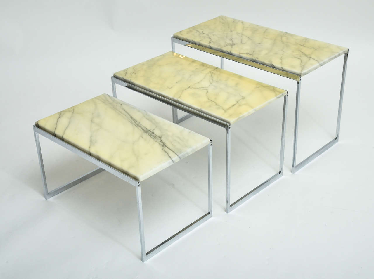 1970s Italian chrome and marble nest of three tables with original marble. Dimensions listed are for largest table.
