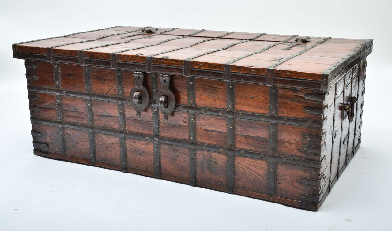 A 19th century Anglo-Indian teak trunk with original iron bindings and lock.
