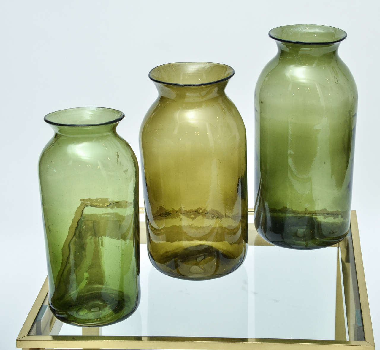 A set of three early 19th century French green cornichons vases.