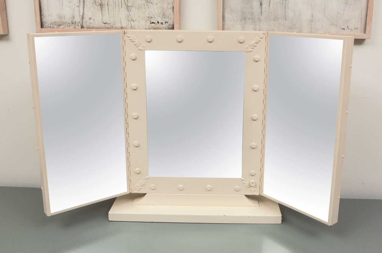 Three-Panel Vintage Vanity Mirror with intricate detailing, beautifully executed in cream colored metal.