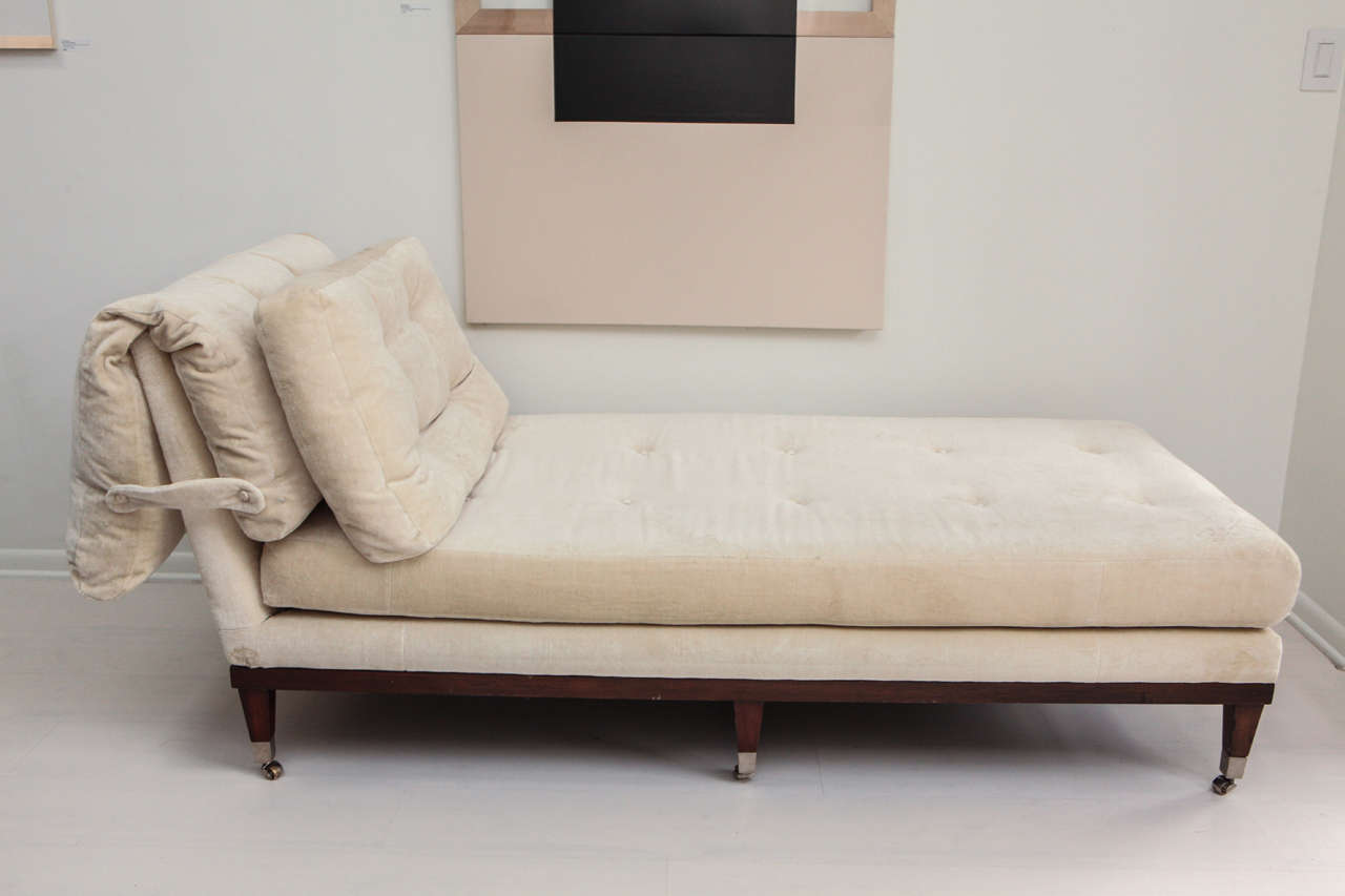 With its soft beige tufted velvet upholstery and comfortable design this piece fits perfectly in any room, perfect for lounging. The upholstered head/back cushion may be adjusted to fit the users body. It is finished with an ebonized wood frame and