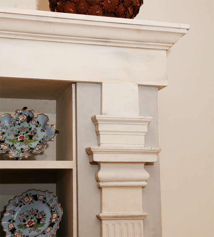 Custom-made Federal style bookcase with four shelves and pilaster trim