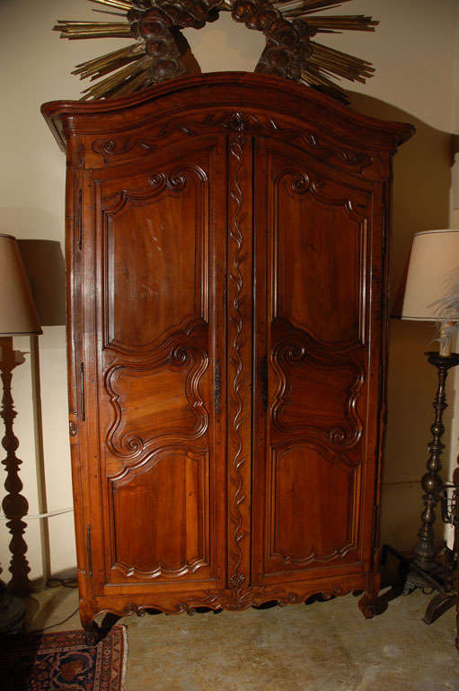 Large, hand-carved, two door, Provencal Armoire with original hardware.