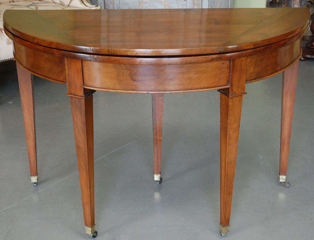An Early 19th Century French Walnut Demilune Fold-over Table