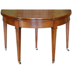 An Early 19th Century French Walnut Demilune Fold-over Table