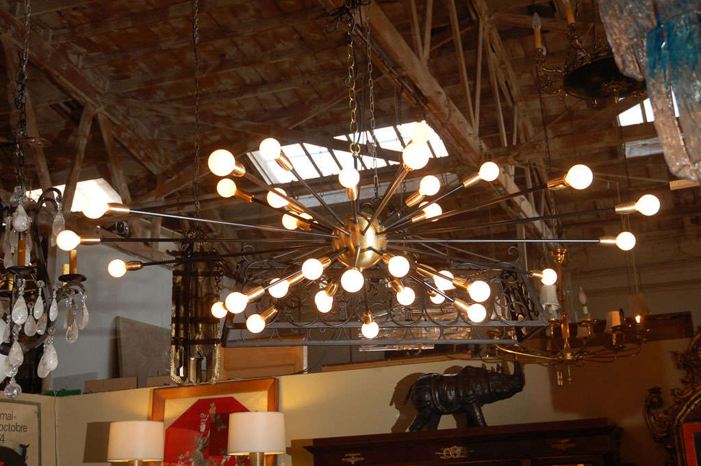 Large 36 light satin brass finish and black painted Sputnik chandelier.