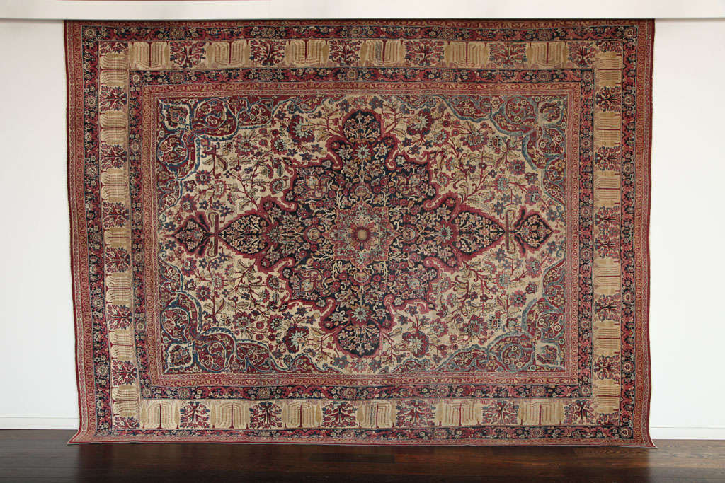 This Persian Kermanshah carpet circa 1880 consists of handspun wool and vegetable dyes. The size is 8'4