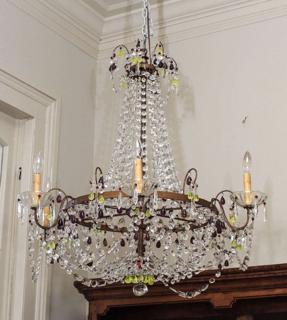 A six light basket form chandelier, the arms sporting three tiers of crystal swags, and overall interspersed with colored beads.  A fresh and elegant interpretation of its 19c. predecessor.