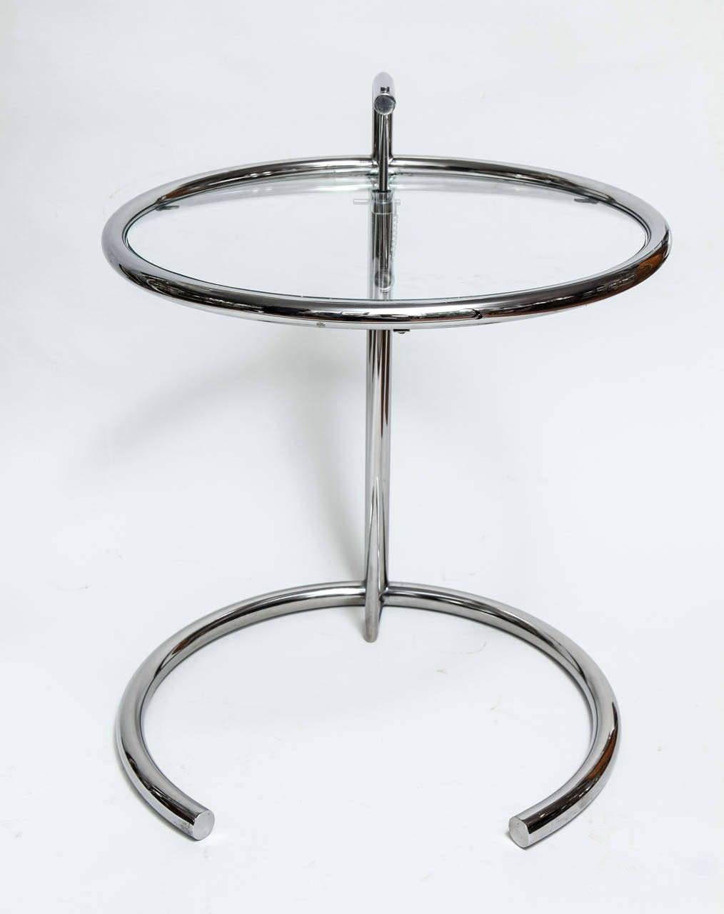 Pair of classic circular adjustable tables designed by Eileen Grey. From 21