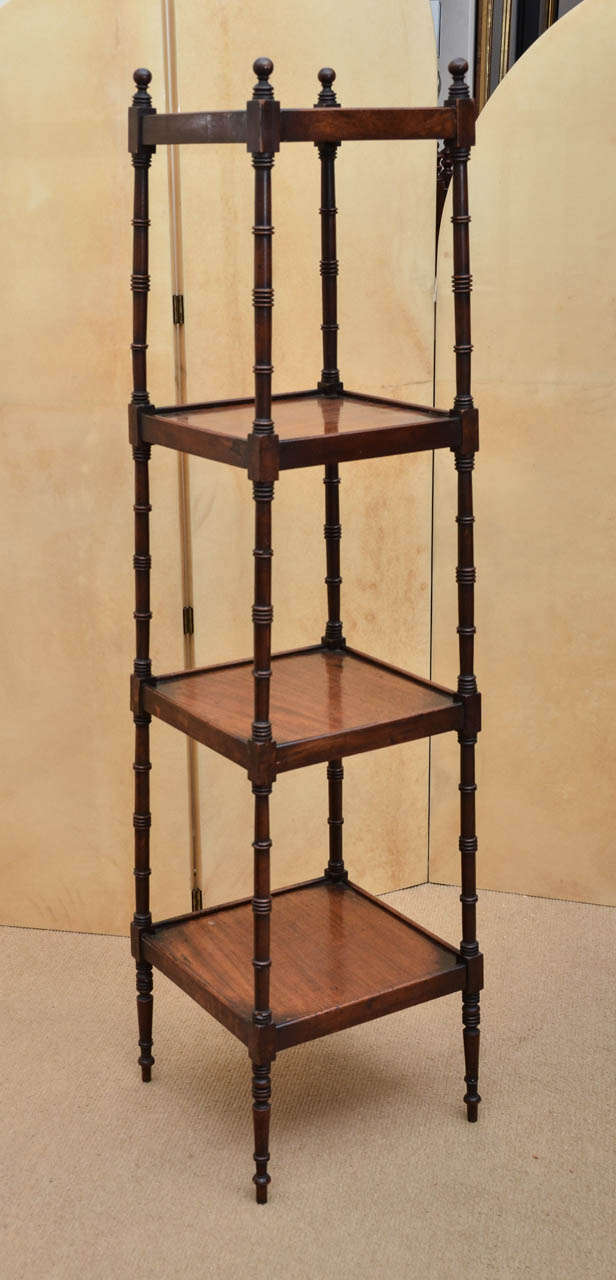 Early 19th century etagere with tapered shelves, faux bamboo turnings.