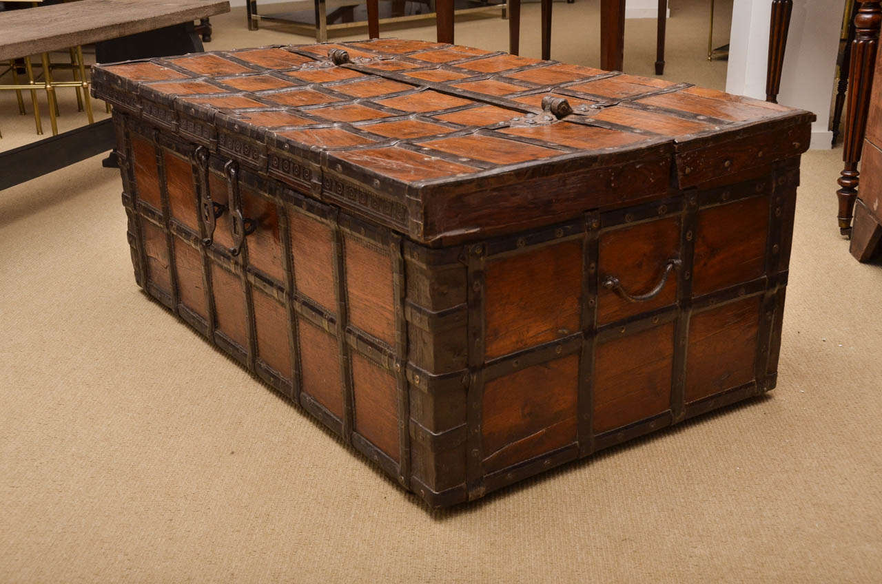 A 19th Century iron bound teak trunk with original banding and carrying handles from the town of Rajasthan.