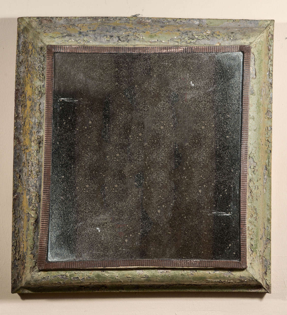 Zinc mirror frame with remnants of old paint and later plate.