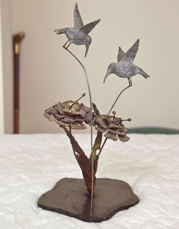 STEEL BASE  WITH BRASS AND STEEL  BIRDS AND FLOWERS. ONE OF A KIND SCULPTURE. HAND MADE BY SILAS AND SIGNED BY HIM