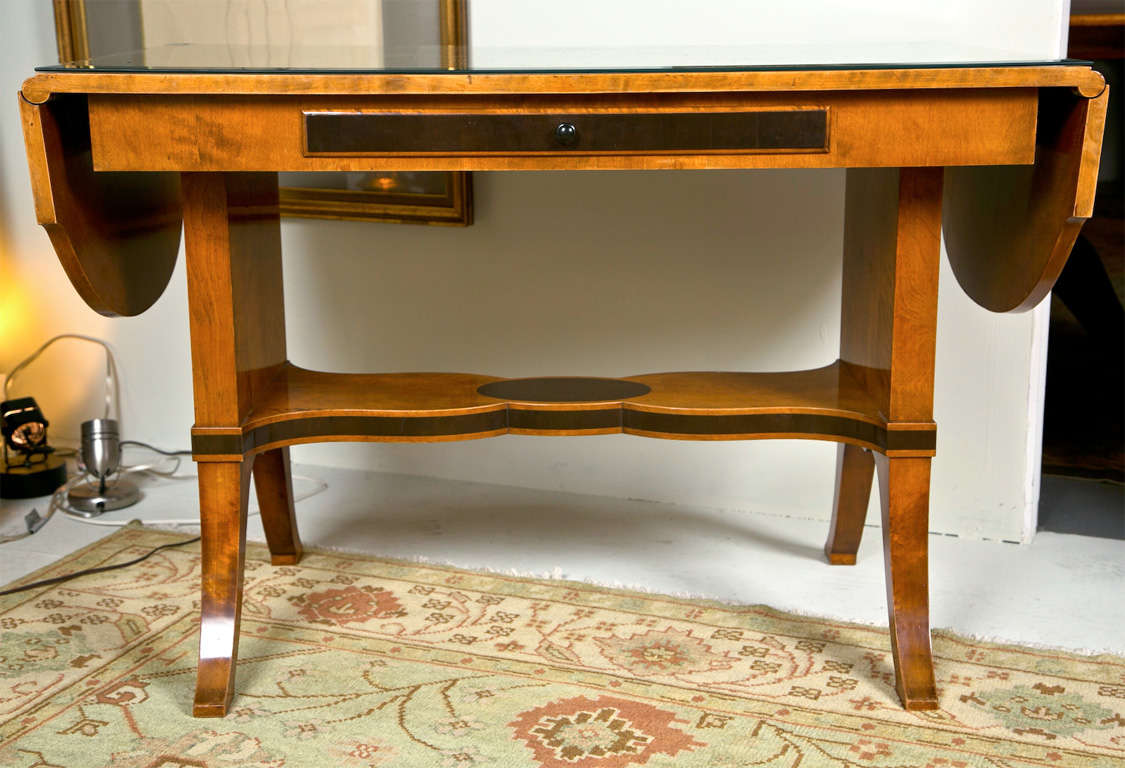 Beautiful satinwood sofa table with figurative inlay, drop  leaf ends and center drawer.