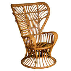 A wicker  Armchair by Gio Ponti.