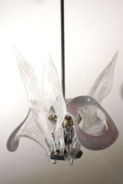 A Modernist Murano chandelier in clear, white and gray flutes and leaves. Has 6 light sockets. Height to the top of the canopy is 48 inches. The chandelier itself is 21 inches high (bottom to top of tall leaves). Chrome pole to canopy can be cut to