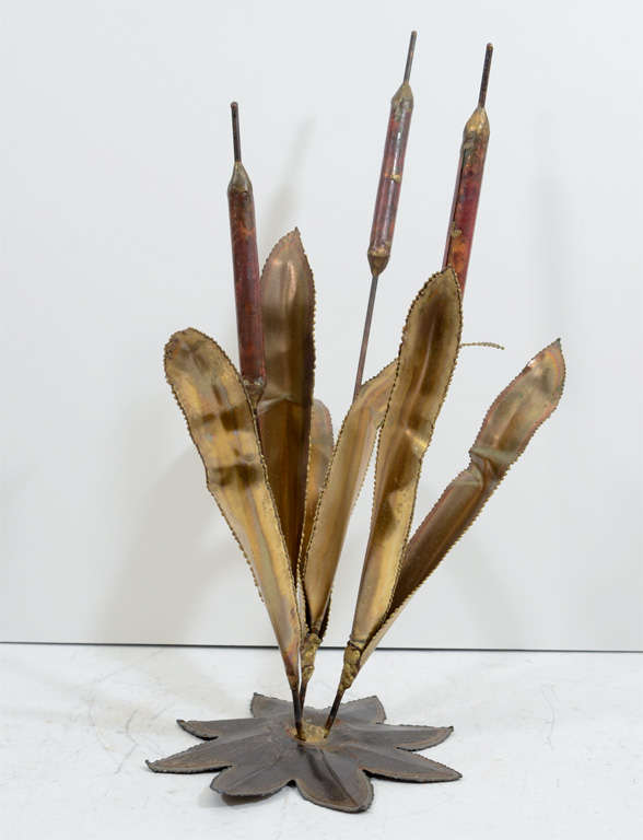 A vintage cattail table-top sculpture in patinated brass.

Reduced from $500.00