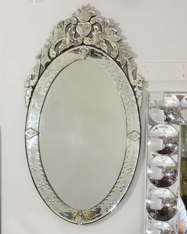 Mid Century Oval Venetian Mirror With Scrolling And Heart Detail At A Vintage Oval Venetian Wall Mounted Mirror With Elaborate Scrolling Framing Heart On The